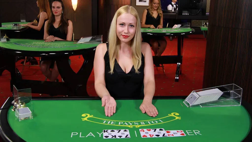 Baccarat live dealer at Evolution Gaming. Table with cards displayed for player and banker.